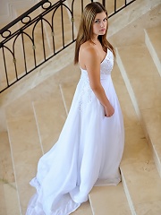 Danielle poses in a long white gown